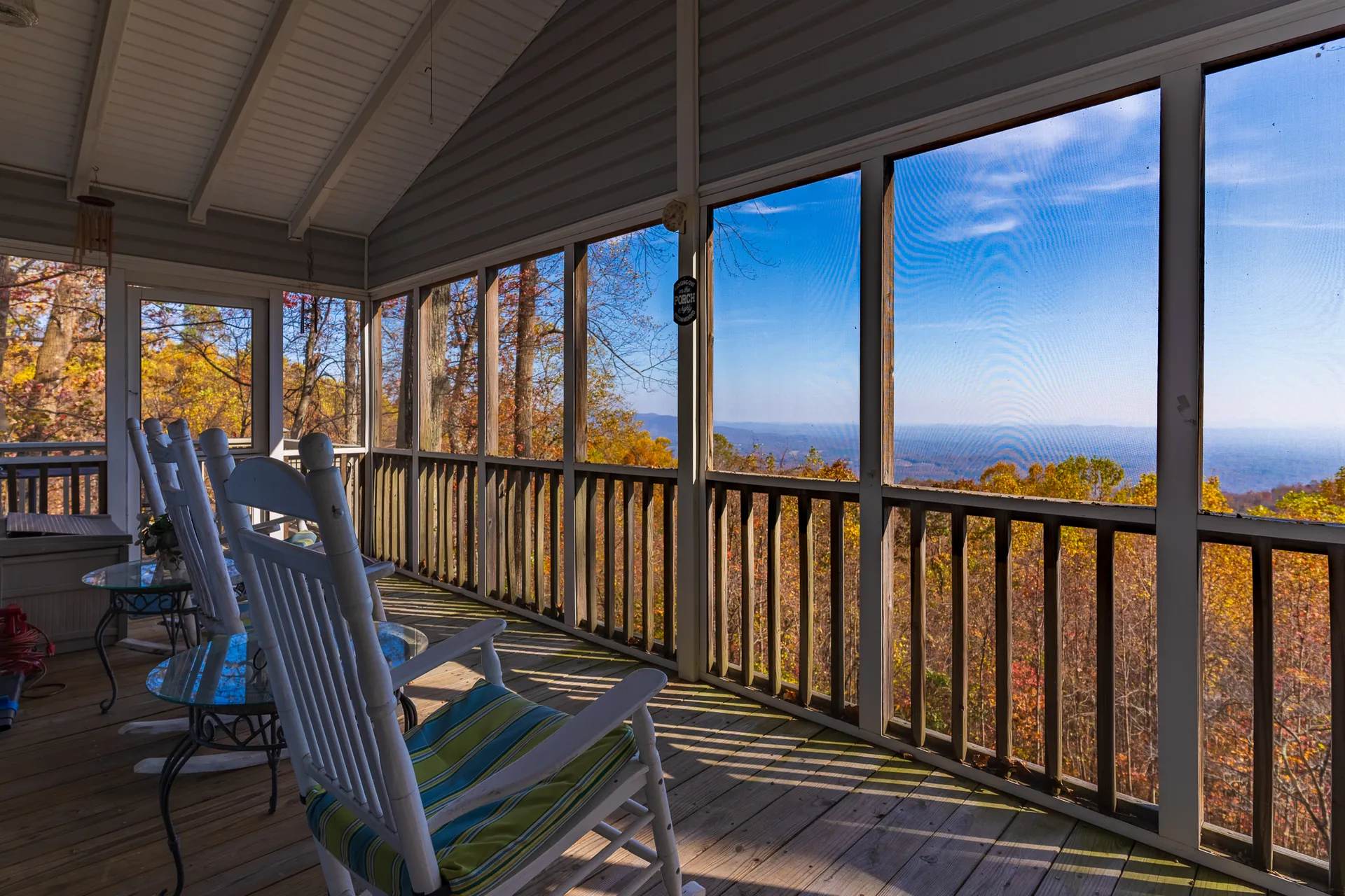 Professional real estate photographer with camera capturing interior of luxury home