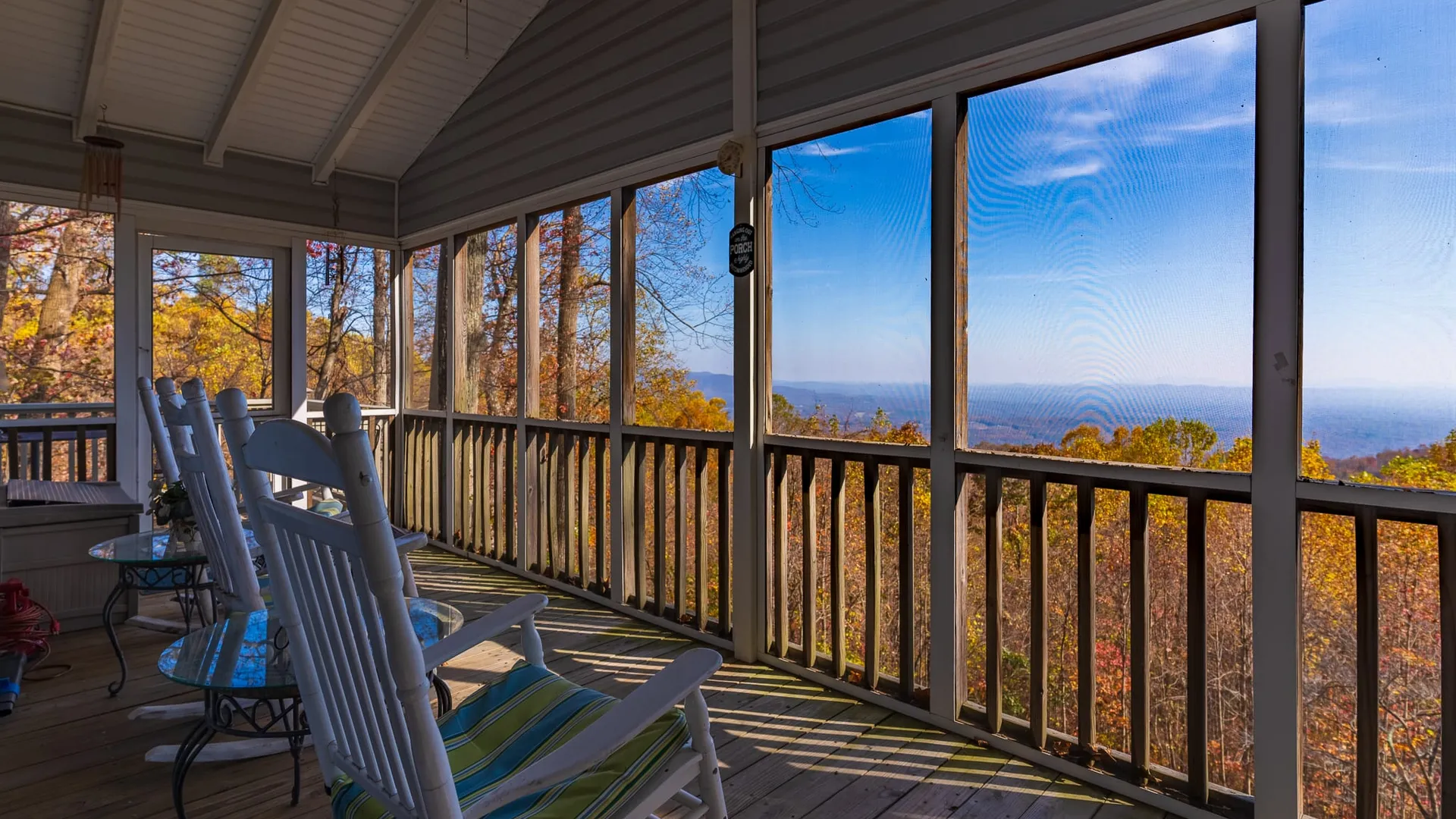 Professional real estate photographer with camera capturing interior of luxury home