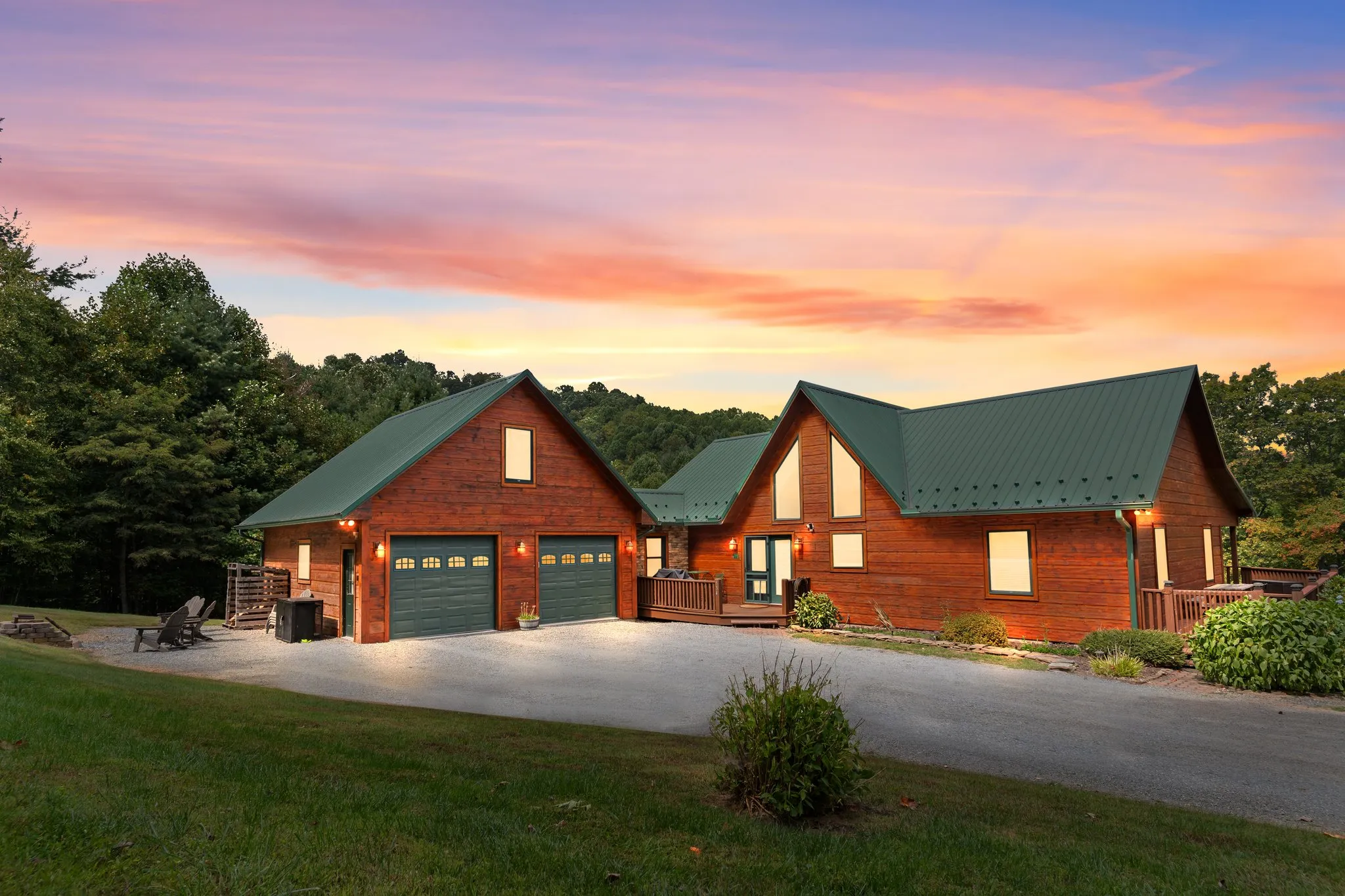 A Blue Ridge property photographed at dusk with the mountains behind it